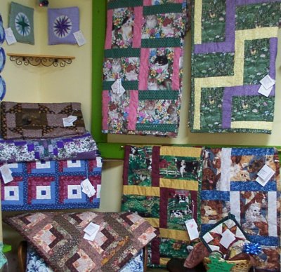 Display of Rail Fence Themed Lap Quilts at retail shop of Long Meadow Farms Quilts