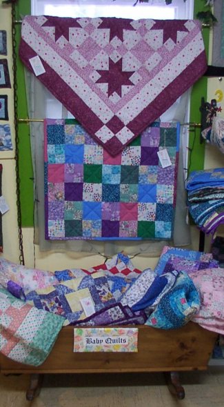 Baby Size Quilts Display at Retail Store of Long Meadow Farms Quilts